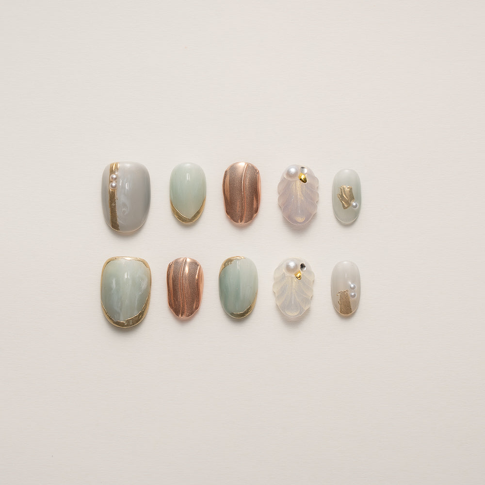 Coastal Celestial Jade & Shell Luxury Press-On Nails showcasing jade green tones and pearl embellishments for an elegant ocean-inspired manicure set.