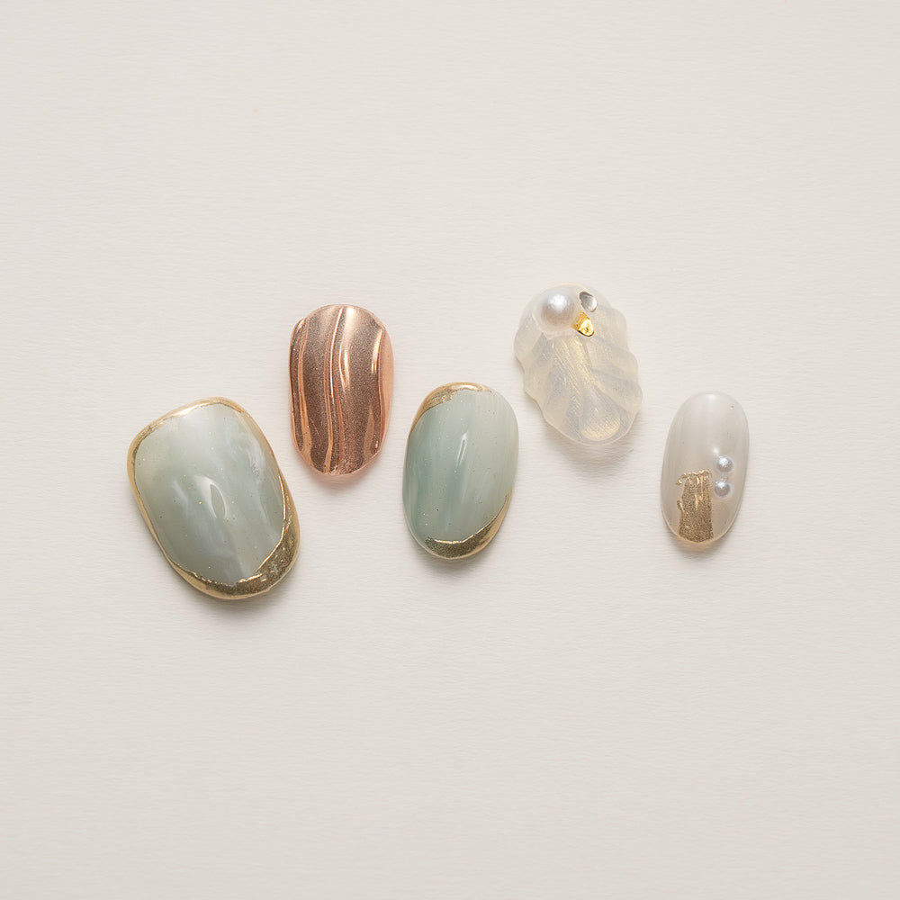Elegant ocean-inspired Coastal Celestial Jade & Shell Luxury Press-On Nails with sculpted shell details and metallic gold accents.