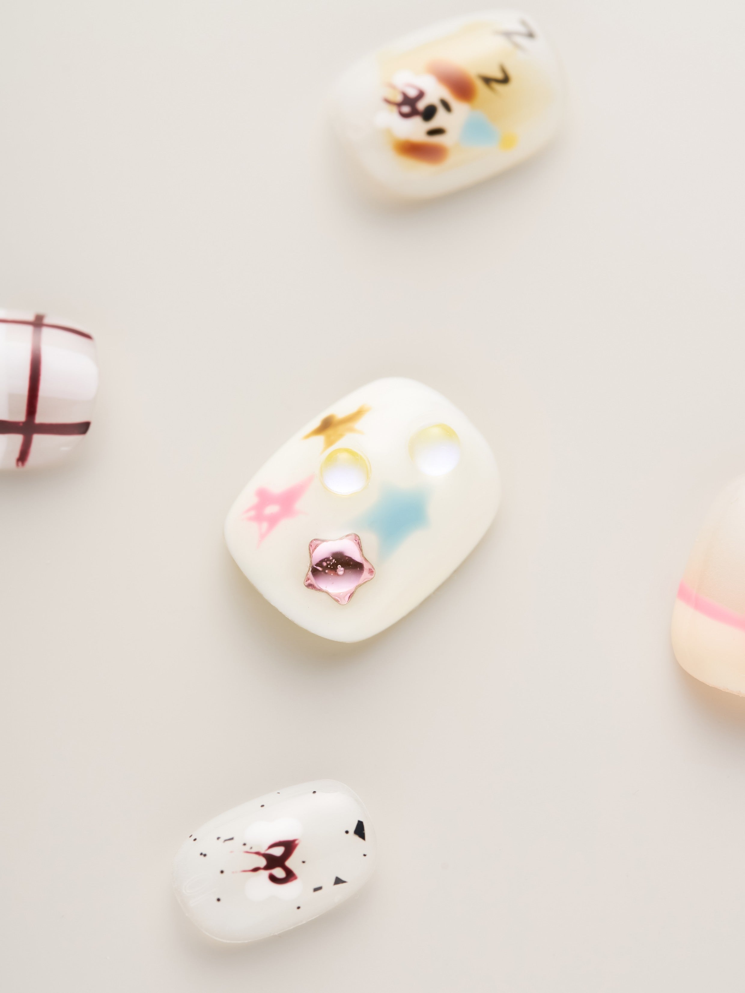 Detailed view of Whimsical Starry Night Squoval Press-On Nails highlighting unique patterns and colorful accents, perfect for adding a vibrant touch.