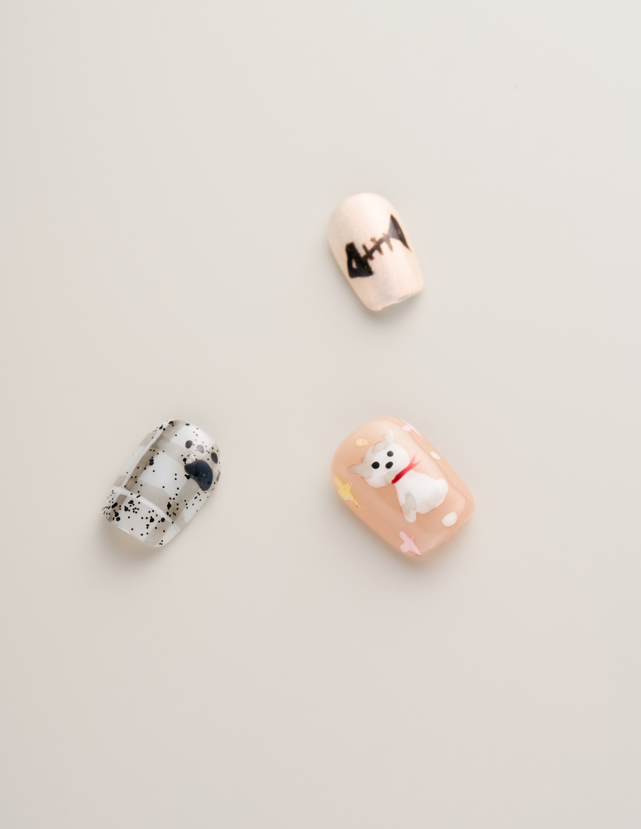 Detailed view of Playful Cat Lover’s Squoval Press-On Nails highlighting adorable cat illustrations and playful patterns.