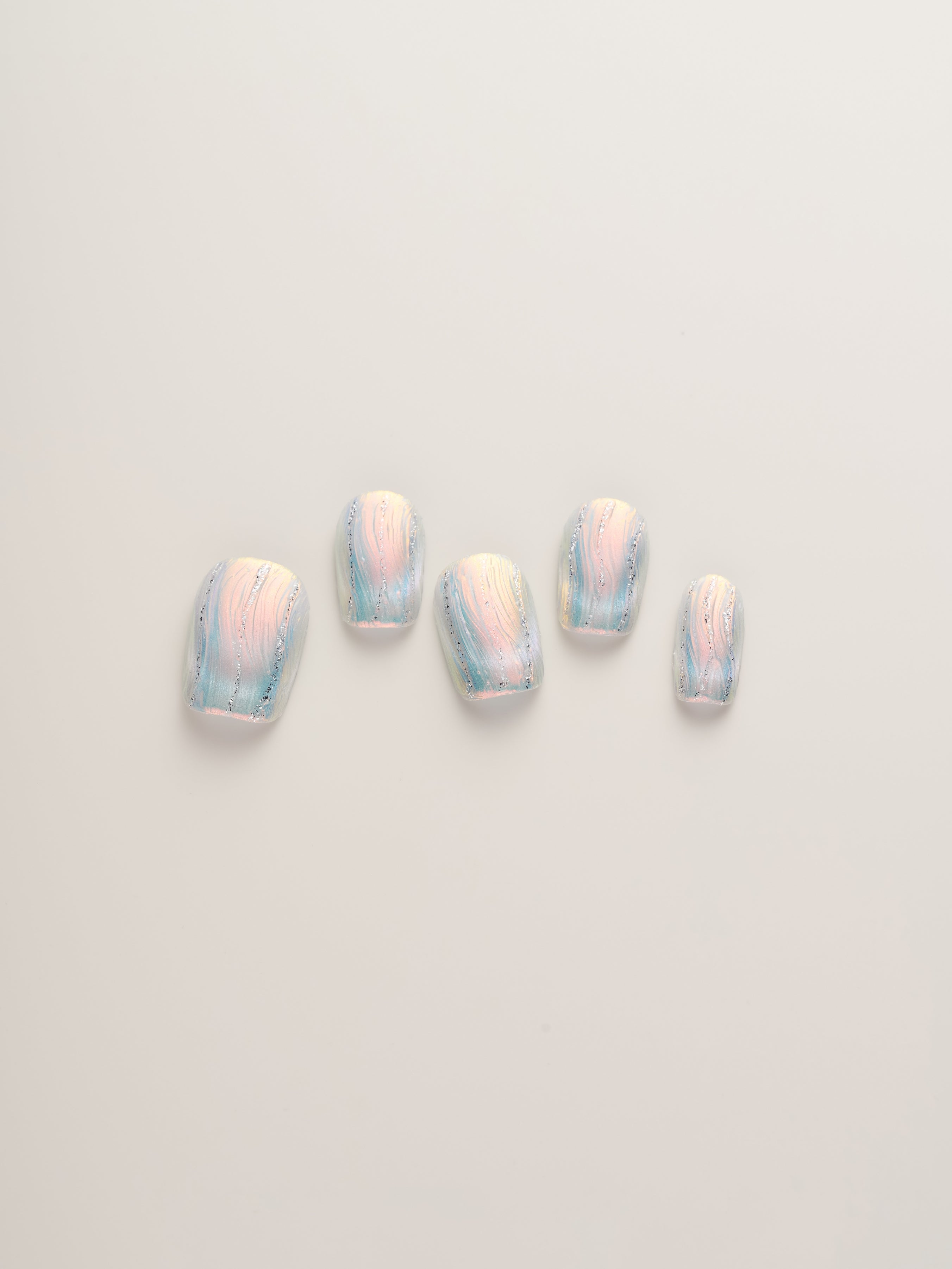 Iridescent Frosted Squoval Press-On Nails showcasing a 5 piece set with pastel colors and frosted textures, ideal for any elegant occasion.
